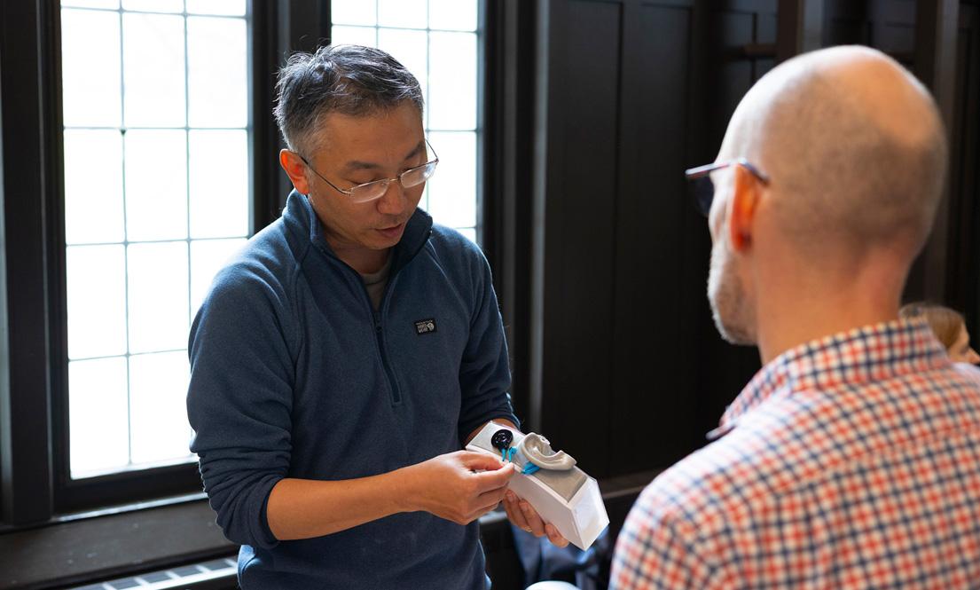 Instructor demonstrating a hearing device 